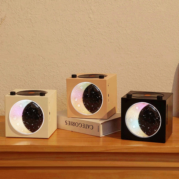 Moon Starry Sky Atmosphere Light Bluetooth Speaker featuring a retro vinyl design with warm starry sky lights.