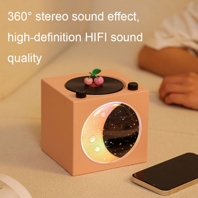 Moon Starry Sky Atmosphere Light Bluetooth Speaker featuring a retro vinyl design with warm starry sky lights.