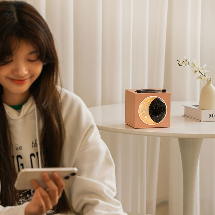 Moon Starry Sky Atmosphere Light Bluetooth Speaker featuring a retro vinyl design with warm starry sky lights.