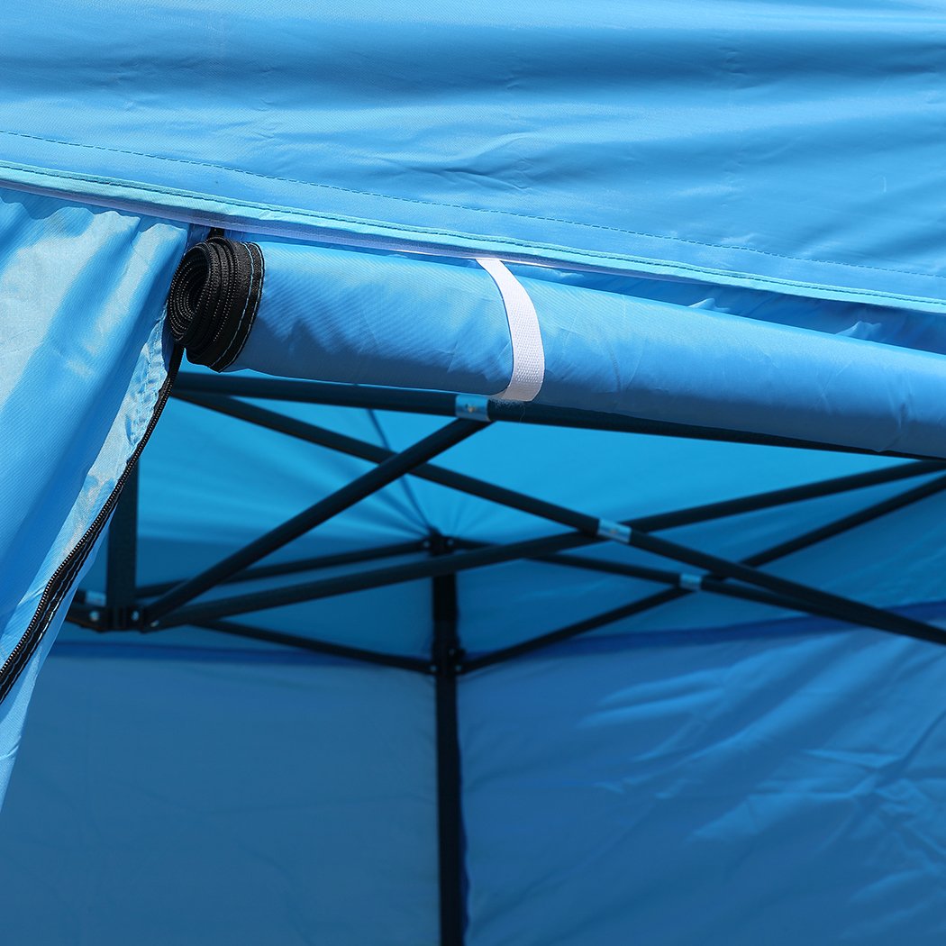 Mountview Gazebo Tent 3x6 with blue canopy and mesh walls, set up outdoors for camping or events.