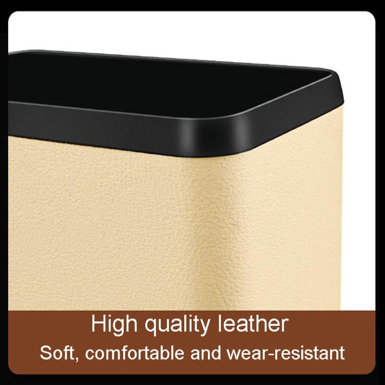 Multifunctional car dustbin hanging on a car seat, made of ABS and leather, designed for storage and waste disposal.