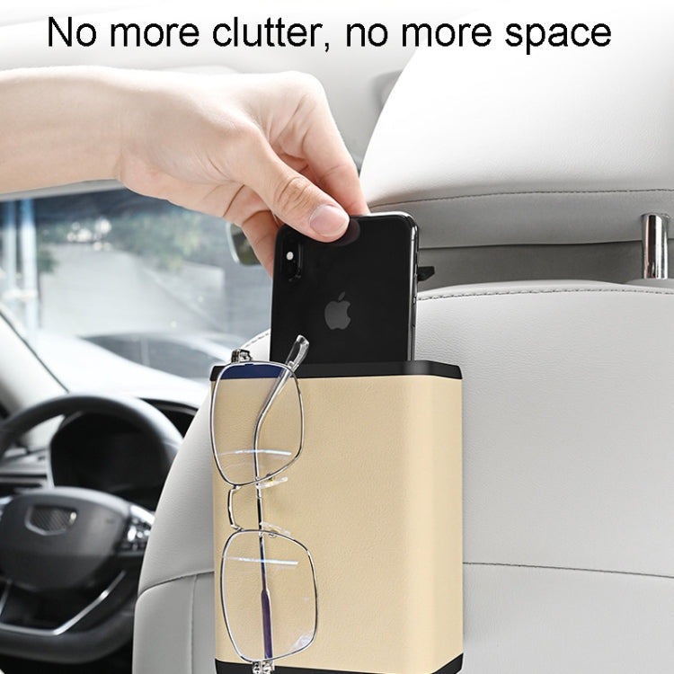 Multifunctional car dustbin hanging on a car seat, made of ABS and leather, designed for storage and waste disposal.