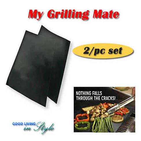 My Grilling Mate non-stick grilling mats on a barbecue grill, showcasing their flat surface and perfect grill marks.
