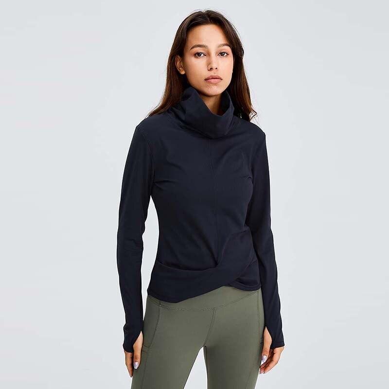 Women wearing a Naked Feel Turtle Neck Yoga Long Sleeve Shirt in a fitness setting, showcasing its stylish design and thumb hole feature.