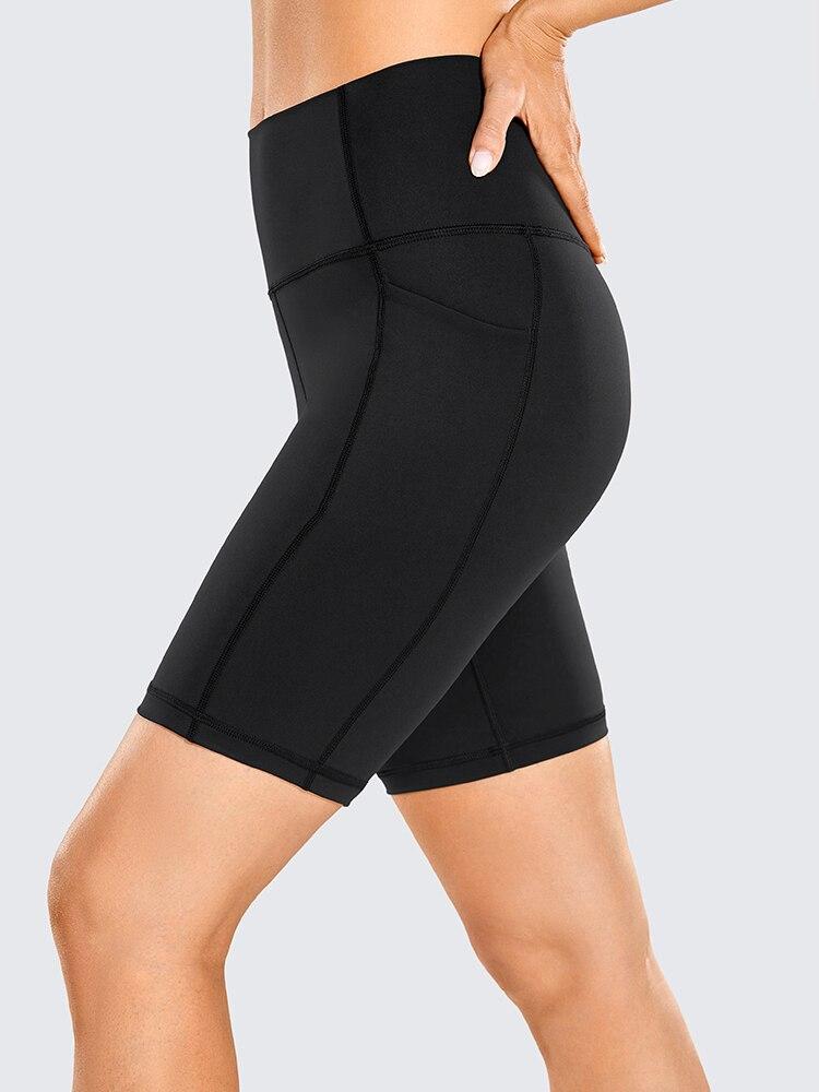 A pair of women's high-waisted biker shorts in solid color with pockets, designed for comfort and active wear.