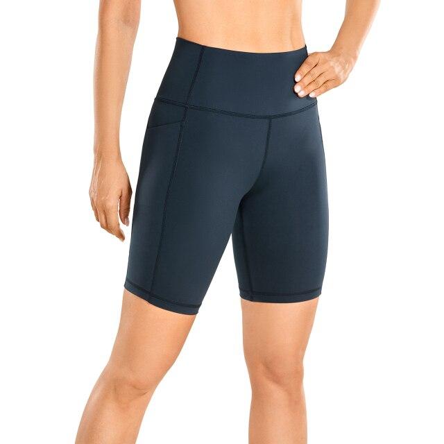 A pair of women's high-waisted biker shorts in solid color with pockets, designed for comfort and active wear.