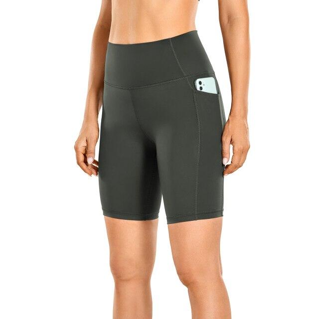 A pair of women's high-waisted biker shorts in solid color with pockets, designed for comfort and active wear.