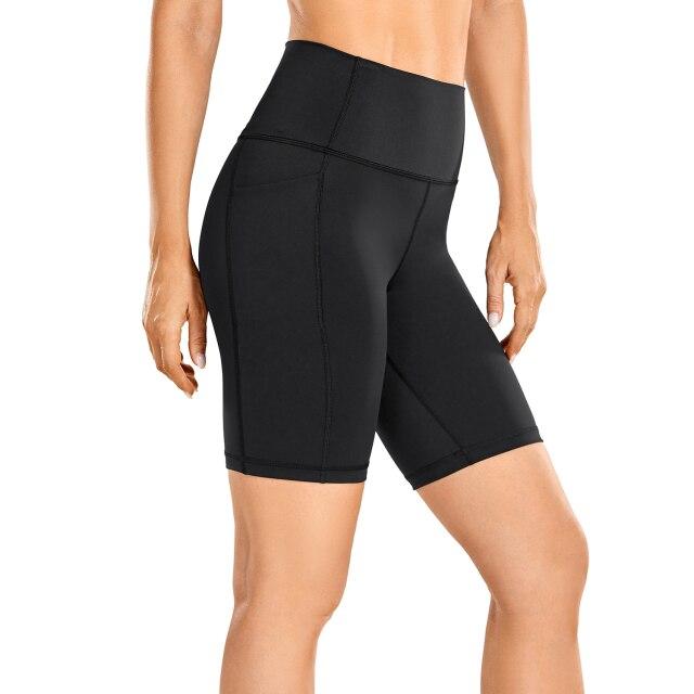 A pair of women's high-waisted biker shorts in solid color with pockets, designed for comfort and active wear.