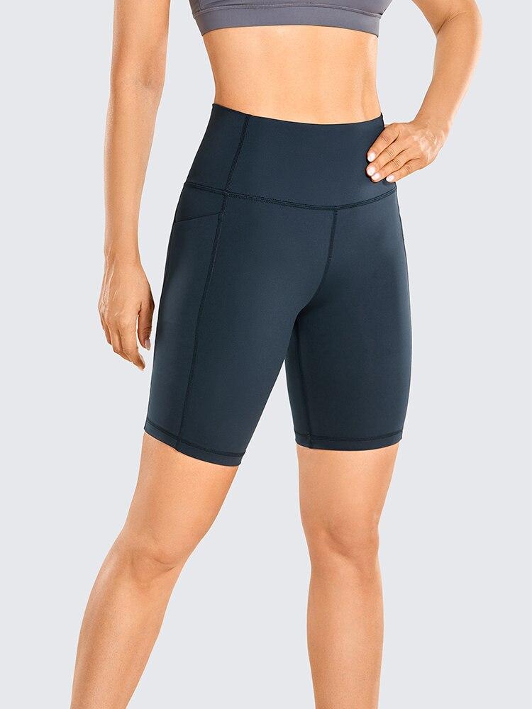 A pair of women's high-waisted biker shorts in solid color with pockets, designed for comfort and active wear.