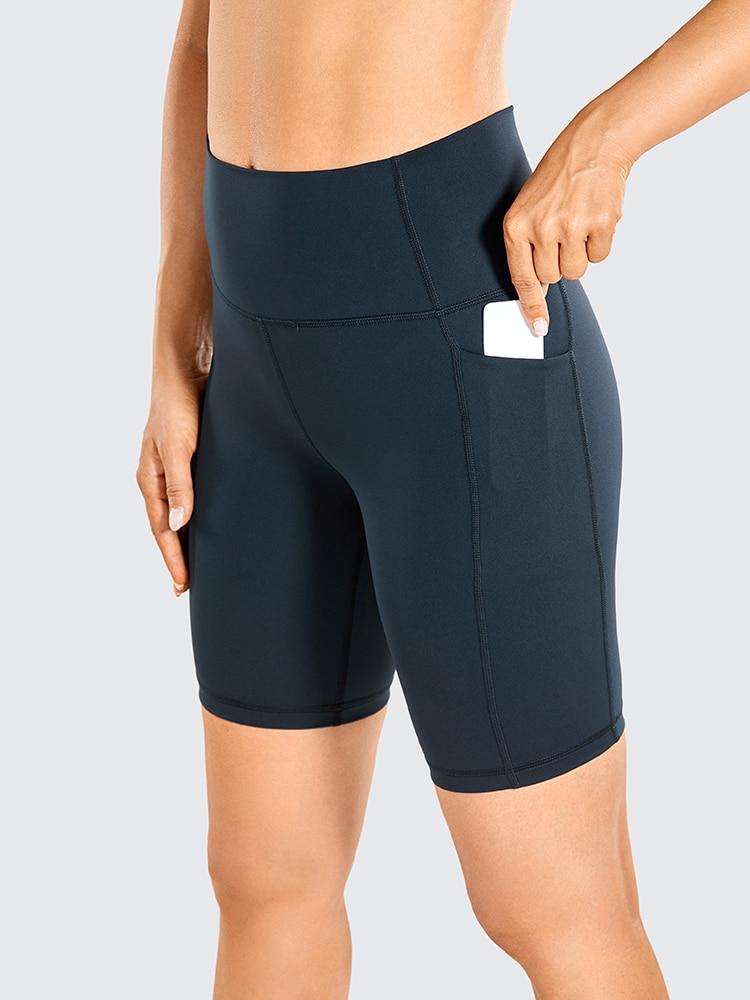 A pair of women's high-waisted biker shorts in solid color with pockets, designed for comfort and active wear.
