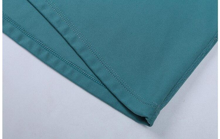 A woman wearing a lightweight, long-sleeved yoga shirt made from naked-feel fabric, ideal for workouts.