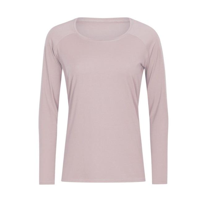 A woman wearing a lightweight, long-sleeved yoga shirt made from naked-feel fabric, ideal for workouts.
