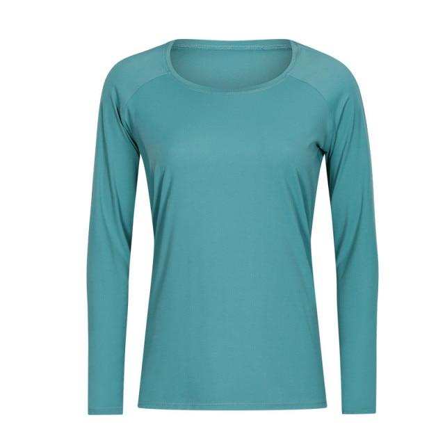 A woman wearing a lightweight, long-sleeved yoga shirt made from naked-feel fabric, ideal for workouts.
