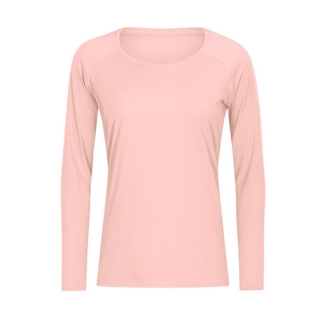 A woman wearing a lightweight, long-sleeved yoga shirt made from naked-feel fabric, ideal for workouts.