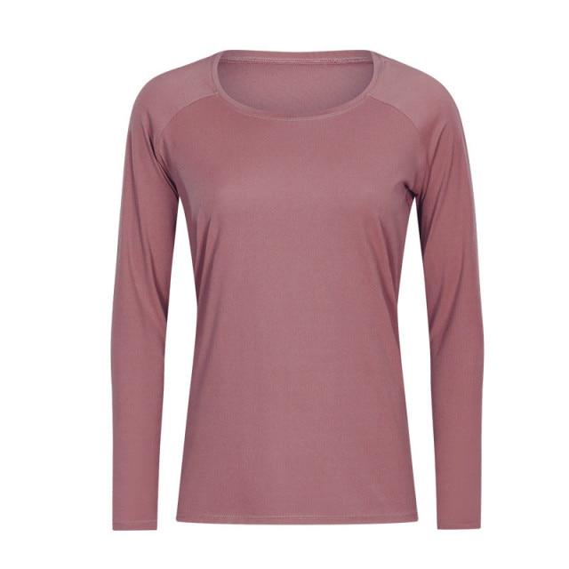 A woman wearing a lightweight, long-sleeved yoga shirt made from naked-feel fabric, ideal for workouts.