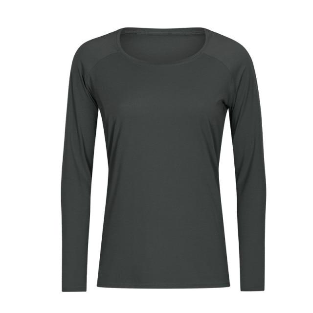 A woman wearing a lightweight, long-sleeved yoga shirt made from naked-feel fabric, ideal for workouts.