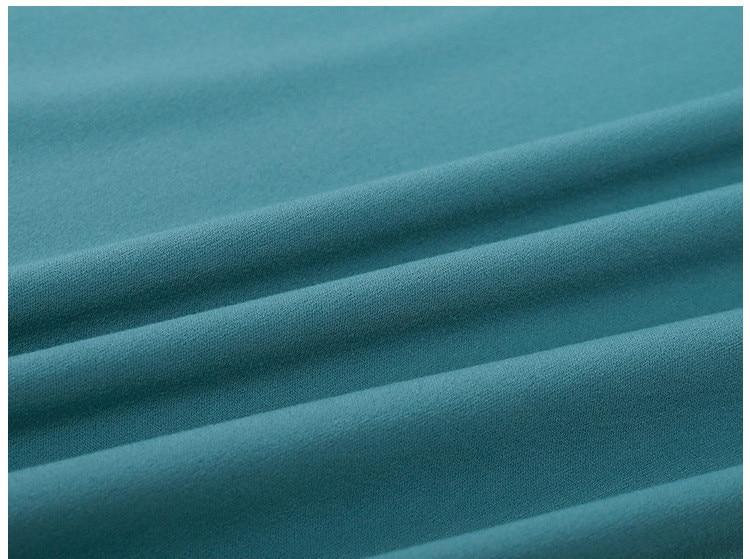 A woman wearing a lightweight, long-sleeved yoga shirt made from naked-feel fabric, ideal for workouts.