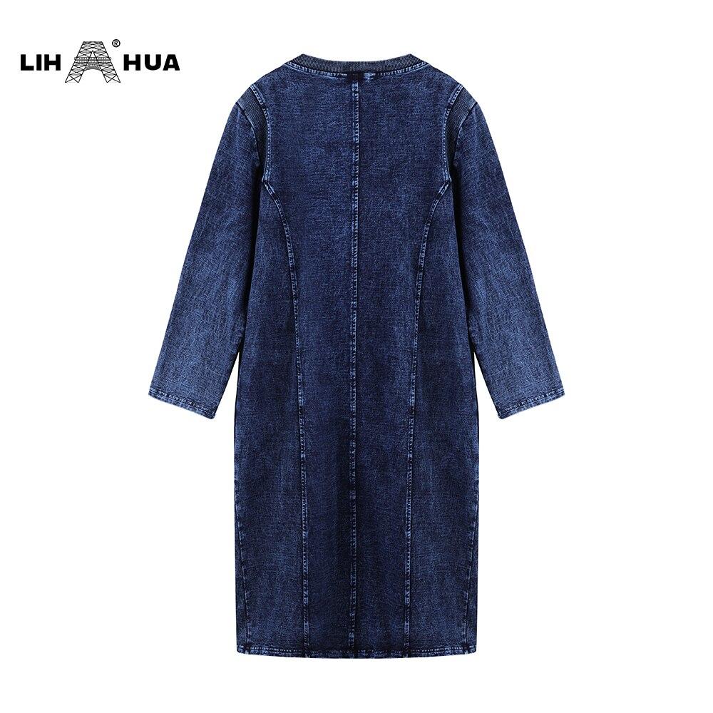 A stylish plus size denim dress featuring a slim fit, knee-length design, and three-quarter sleeves, perfect for casual autumn wear.