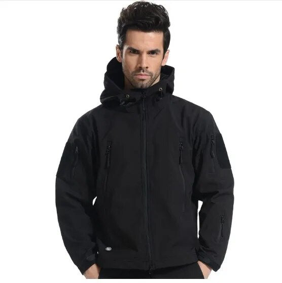 Men's tactical softshell camouflage hiking jacket, showcasing waterproof and windproof features, ideal for outdoor activities.