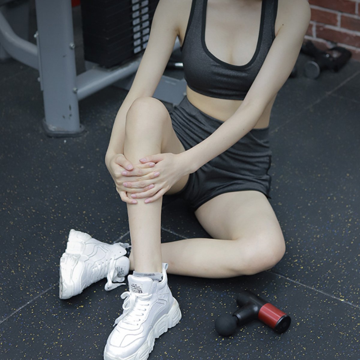 No More Sore Mini Massager and Muscle Toner in various colors, showcasing its compact design and interchangeable heads.