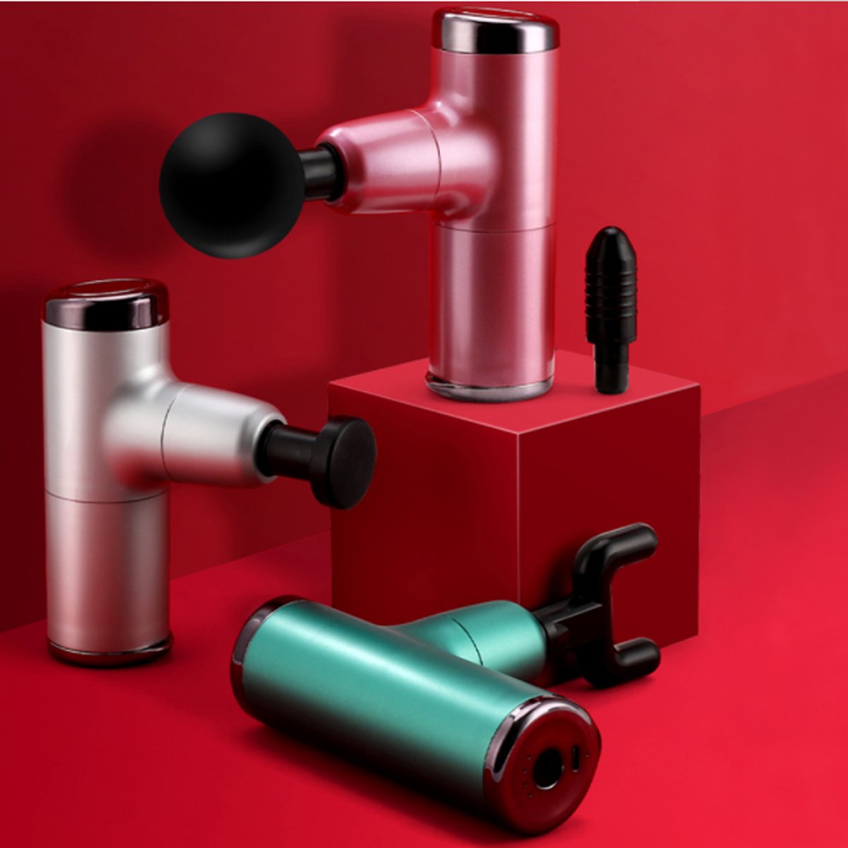 No More Sore Mini Massager and Muscle Toner in various colors, showcasing its compact design and interchangeable heads.