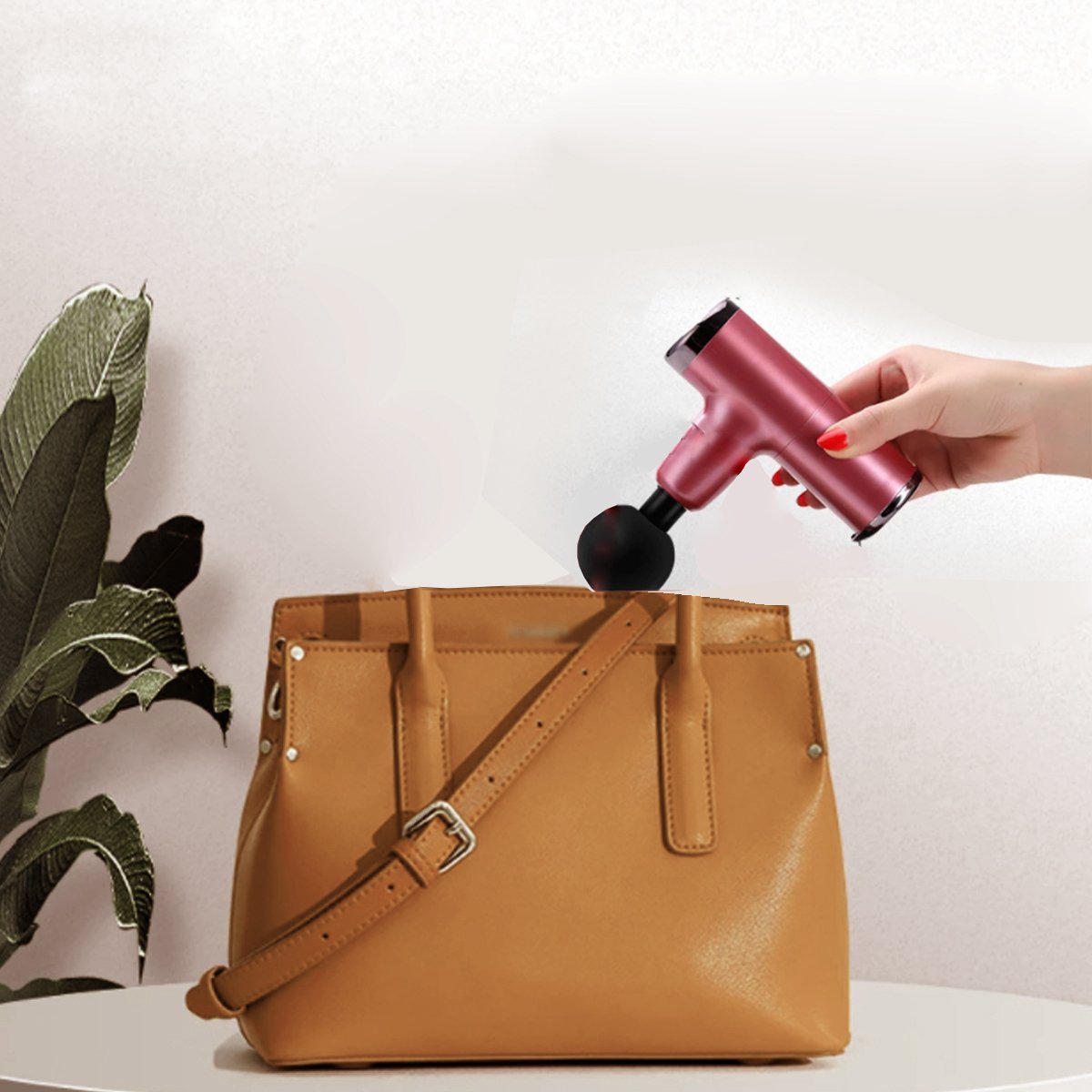 No More Sore Mini Massager and Muscle Toner in various colors, showcasing its compact design and interchangeable heads.