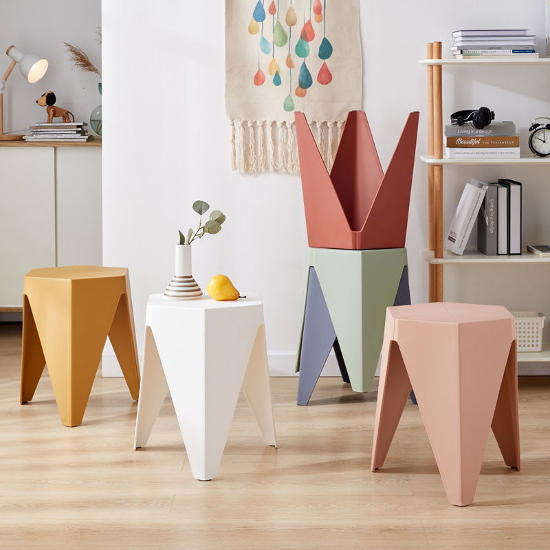 Nordic Plastic Stool in various colors, showcasing its modern design and non-slip surface, ideal for contemporary spaces.