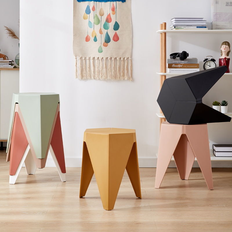 Nordic Plastic Stool in various colors, showcasing its modern design and non-slip surface, ideal for contemporary spaces.