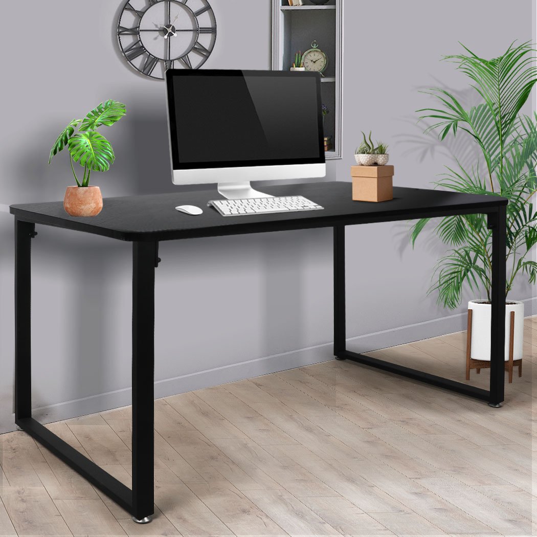 A modern black office desk with a spacious tabletop, sturdy steel frame, and anti-scratch feet pads, ideal for home or study use.