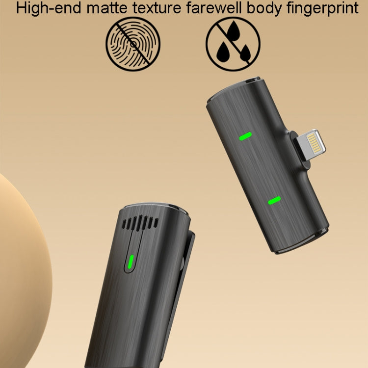 One To Two Outdoor Recording Lavalier Microphone with charging compartment, showcasing its compact design and wireless features.