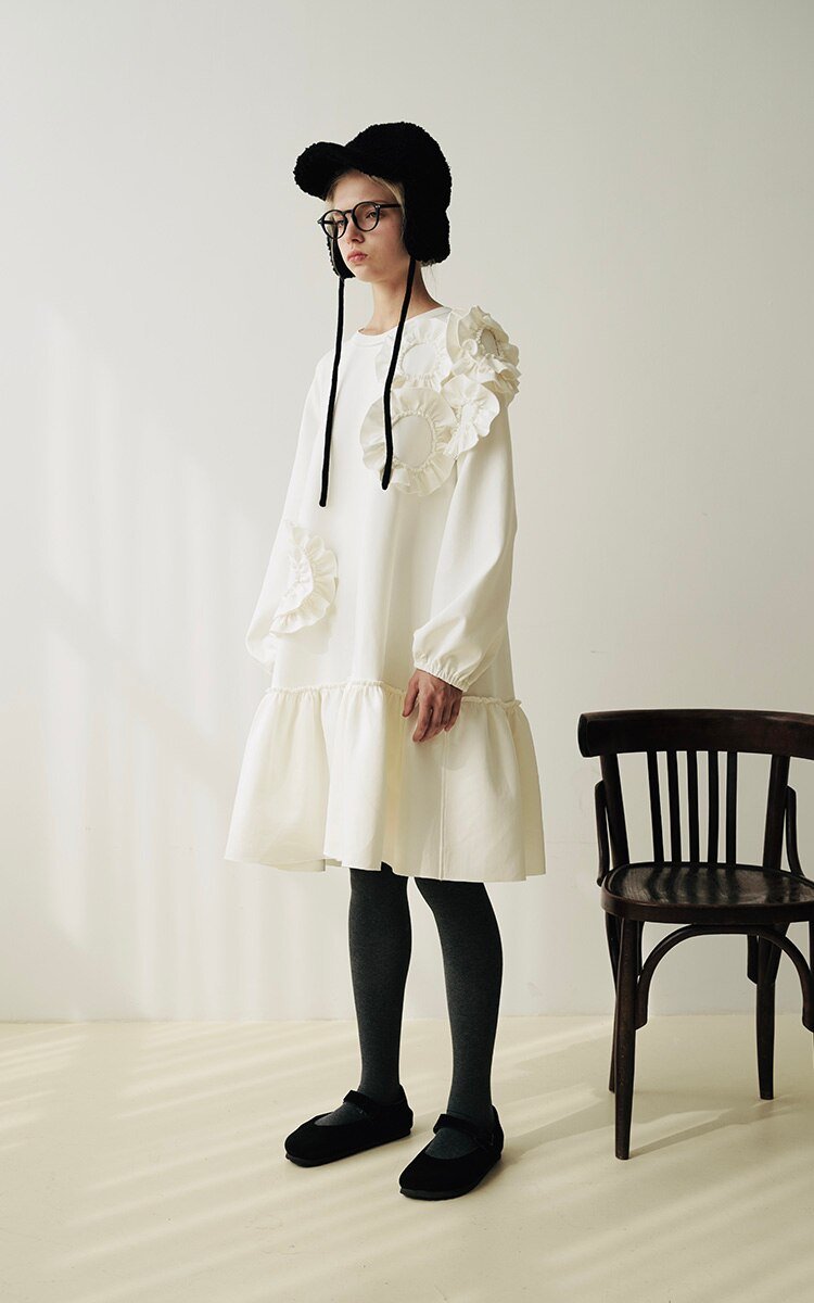 A stylish mid-length ruffled dress featuring a floral pattern, O-neck neckline, and full sleeves, perfect for winter wear.