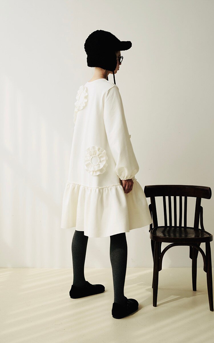 A stylish mid-length ruffled dress featuring a floral pattern, O-neck neckline, and full sleeves, perfect for winter wear.