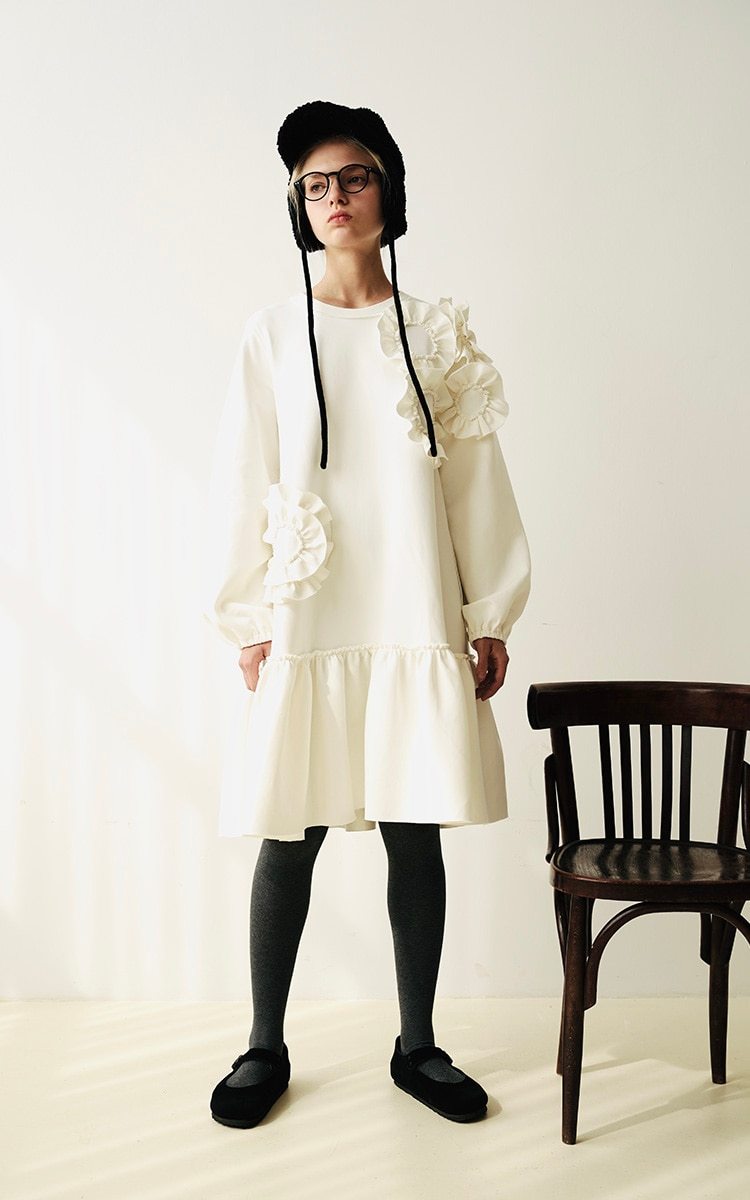 A stylish mid-length ruffled dress featuring a floral pattern, O-neck neckline, and full sleeves, perfect for winter wear.