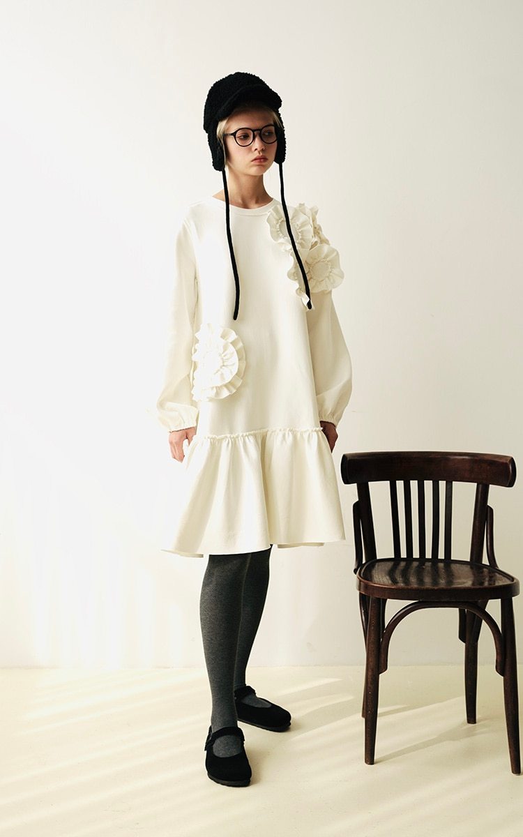 A stylish mid-length ruffled dress featuring a floral pattern, O-neck neckline, and full sleeves, perfect for winter wear.