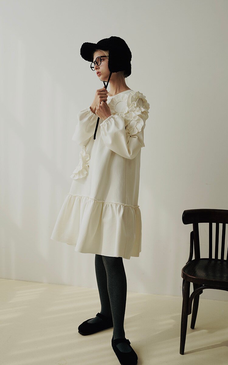 A stylish mid-length ruffled dress featuring a floral pattern, O-neck neckline, and full sleeves, perfect for winter wear.