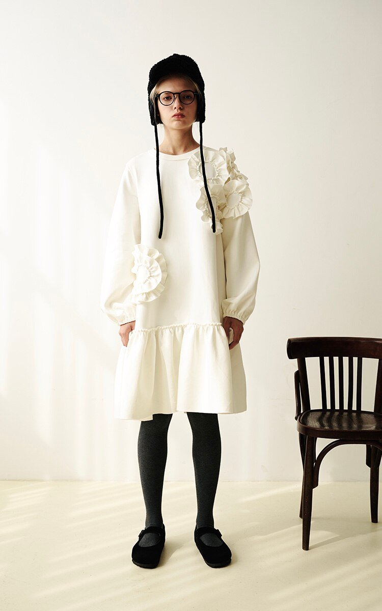 A stylish mid-length ruffled dress featuring a floral pattern, O-neck neckline, and full sleeves, perfect for winter wear.