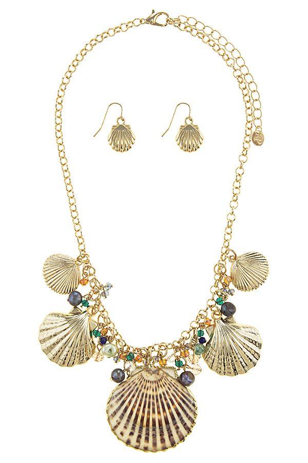 Oversize shell station necklace set featuring a gold finish and adjustable length, perfect for layering or solo wear.