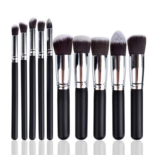 Pagent Winner 10 Pc Make Up Brush Set featuring sustainable wooden handles and soft synthetic bristles, displayed in a stylish black pouch.