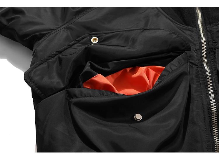 Men's patchwork color winter jacket with button pockets and zipper closure, showcasing a stylish bomber design.