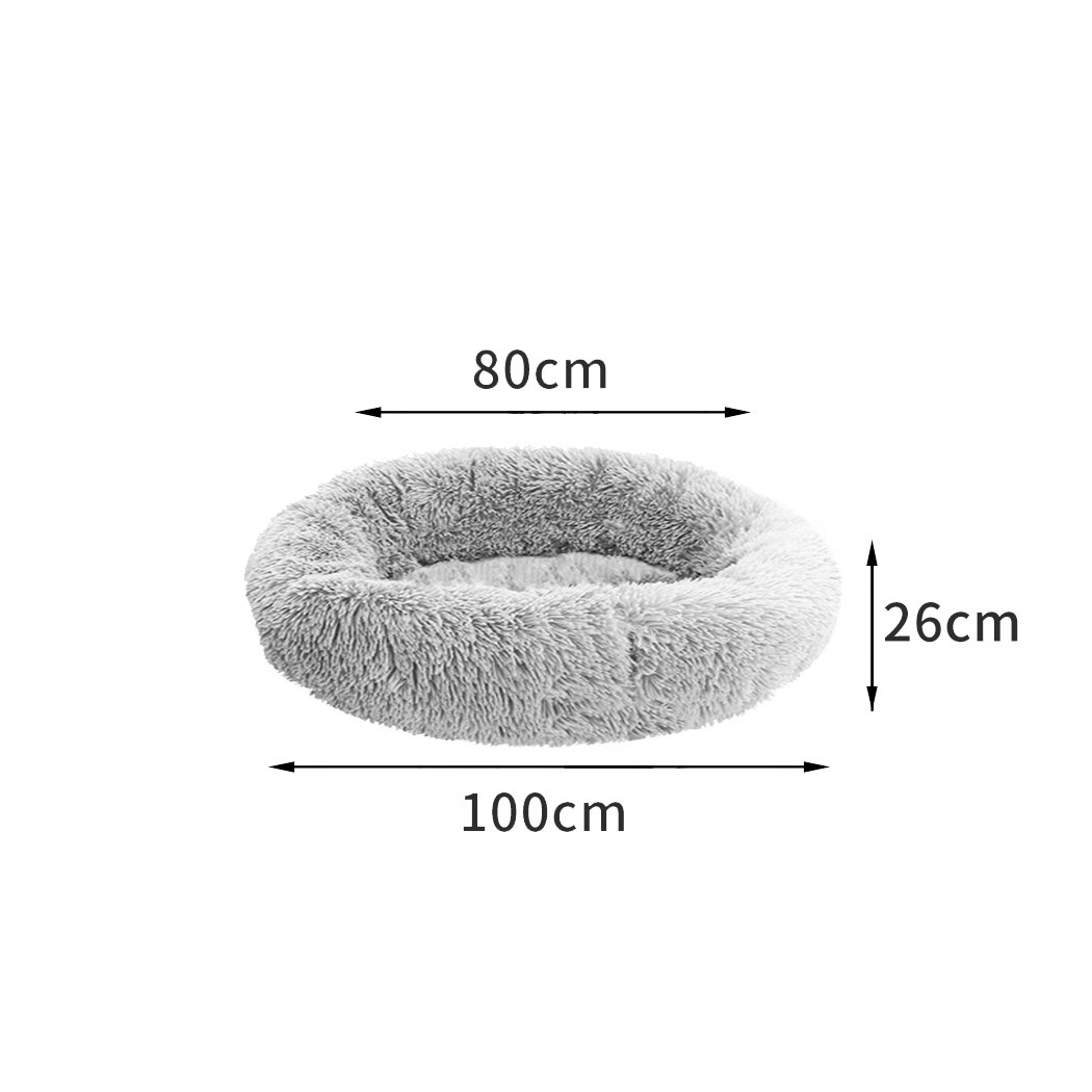 PaWz Pet Bed in light grey, donut-shaped design with plush surface and non-slip bottom, ideal for dogs and cats.