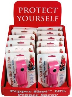 Pepper Shot 0.5 oz pepper spray with pink leatherette holder, featuring a built-in belt clip for easy carrying.
