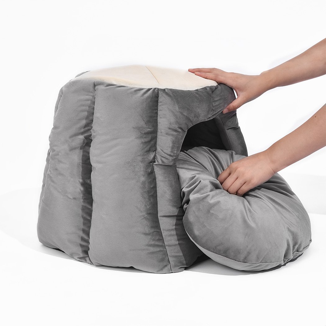 Cozy grey pet bed designed as a cave and donut shape, made from soft flannel material, perfect for winter comfort.