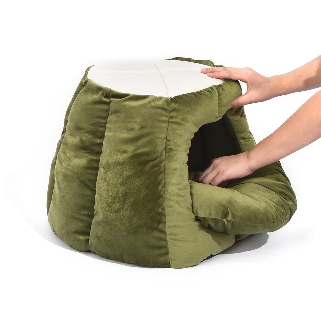 Cozy green pet bed designed as a cave and donut shape for cats, made from soft flannel material, perfect for winter comfort.