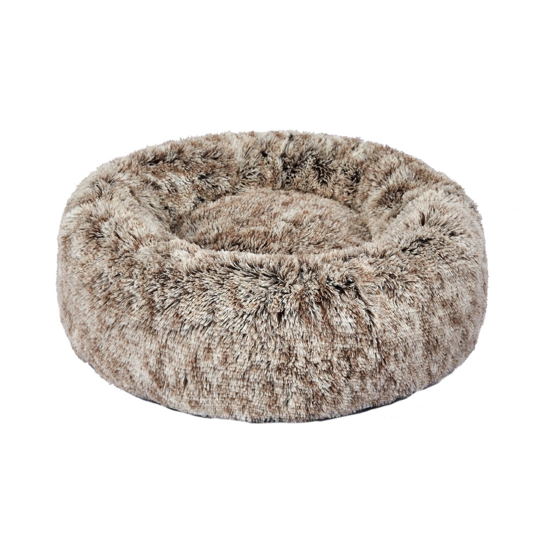A cozy coffee-colored donut-shaped pet bed with plush material and raised rim, perfect for dogs and cats to relax and feel secure.
