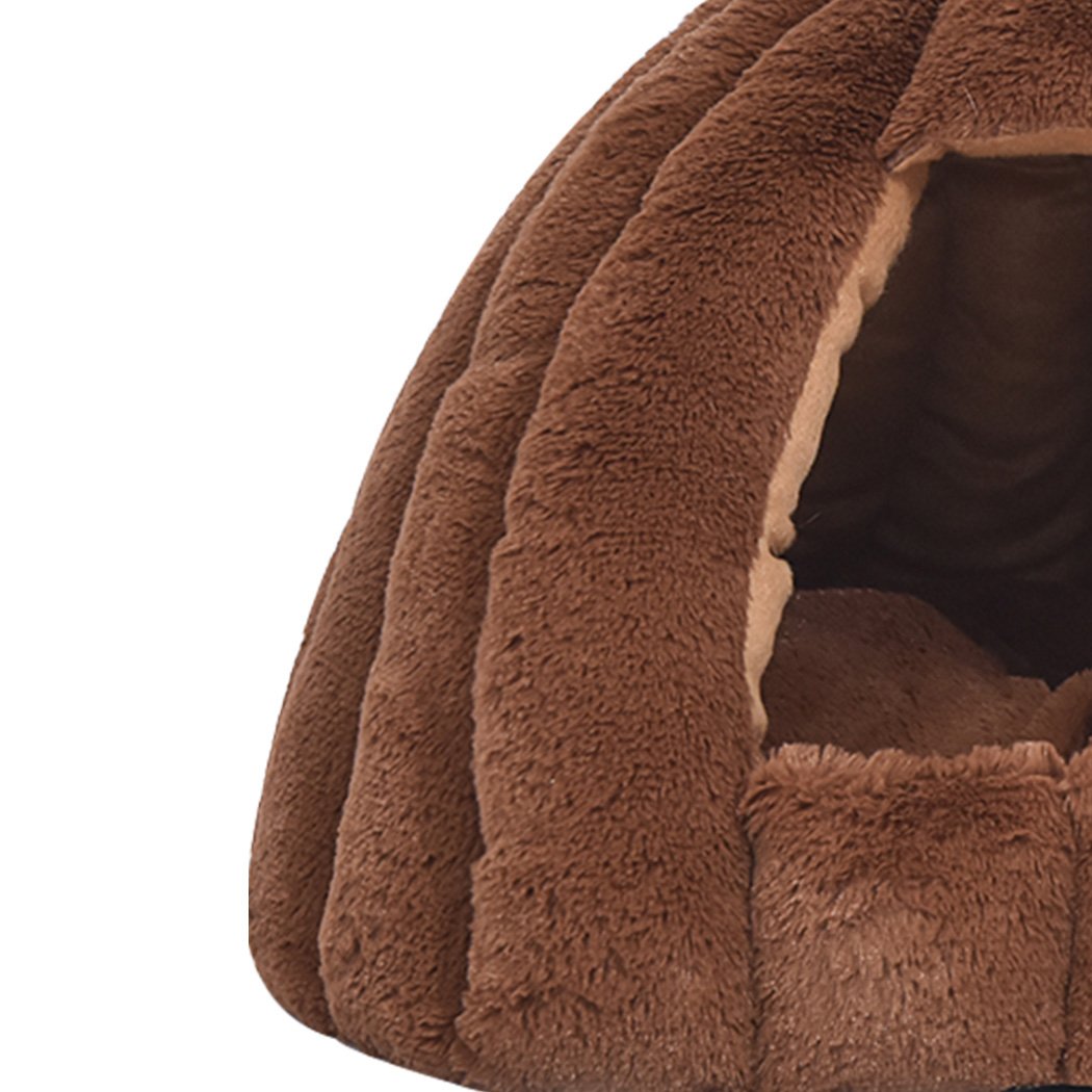 Cozy brown pet bed in pumpkin house design, perfect for cats and dogs, made from soft flannel material.