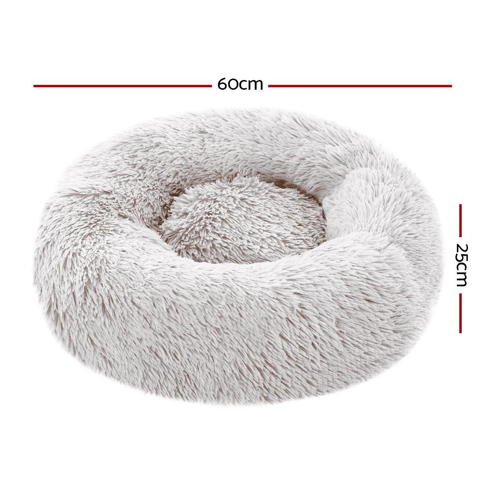 A cozy small 60cm pet bed for dogs and cats, featuring a soft white exterior and a non-slip base, perfect for a comfortable sleep.
