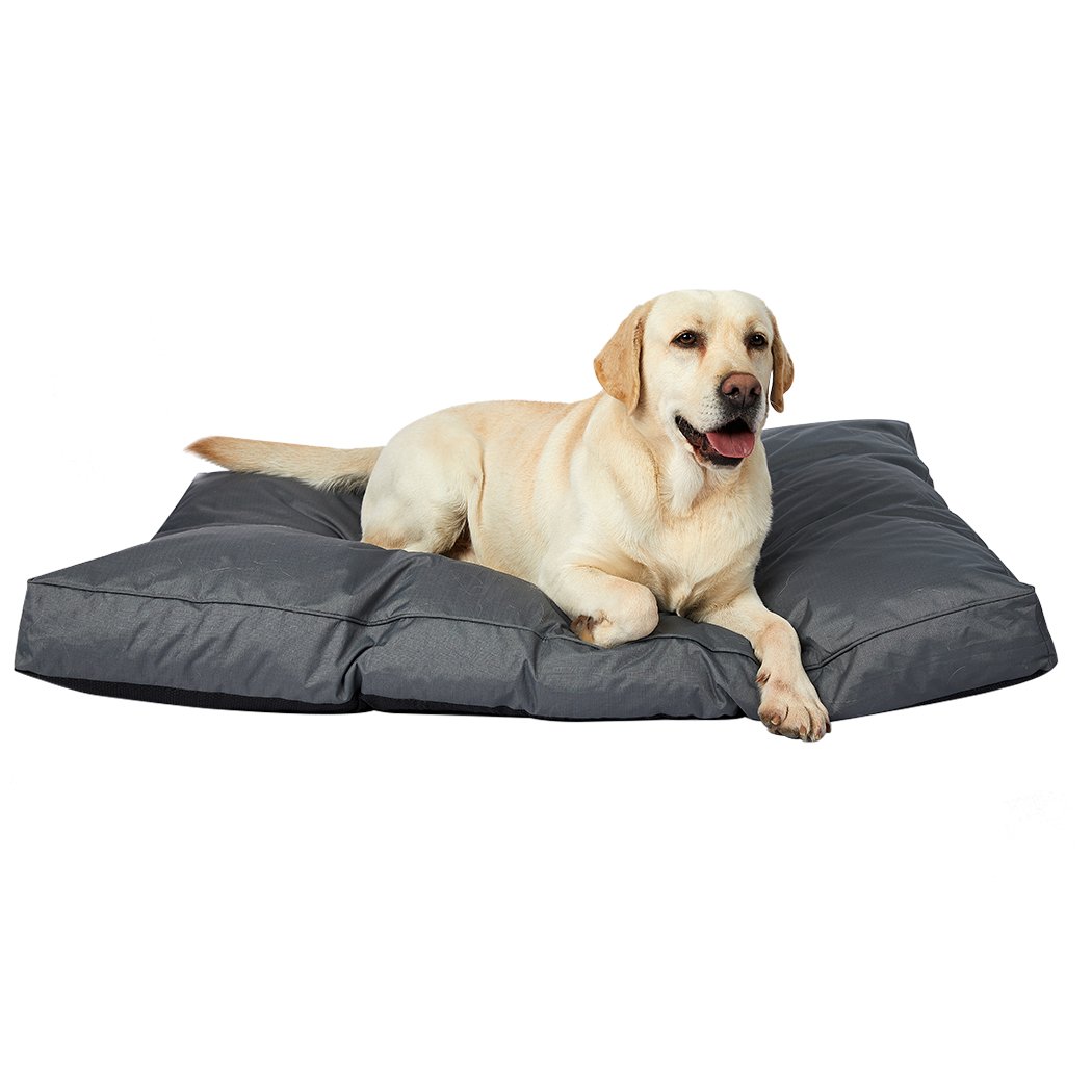 A cozy grey pet bed made of soft fleece and durable oxford fabric, featuring a plush design and ergonomic shape for ultimate comfort.