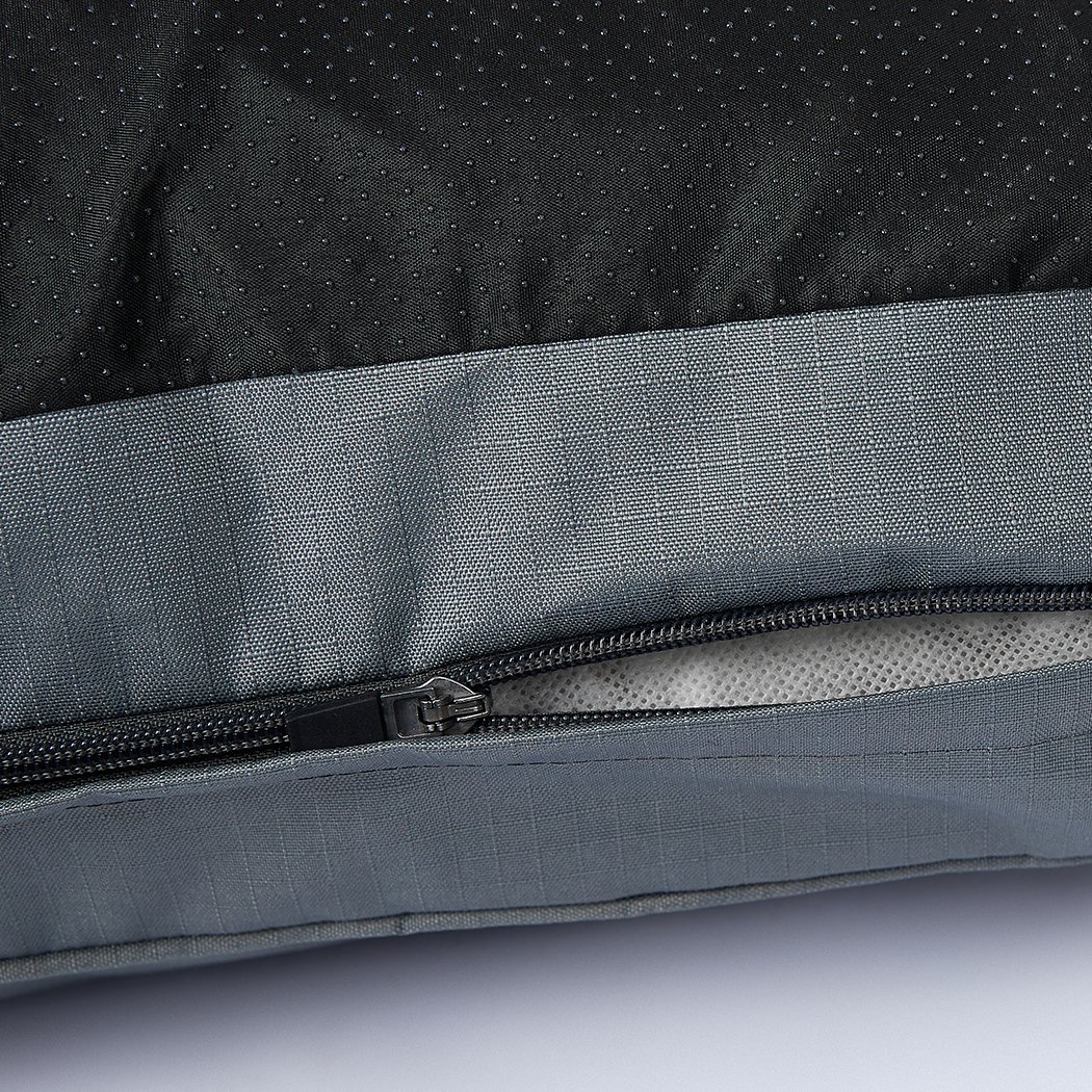 A cozy grey pet bed made of soft fleece and durable oxford fabric, featuring a plush design and ergonomic shape for ultimate comfort.