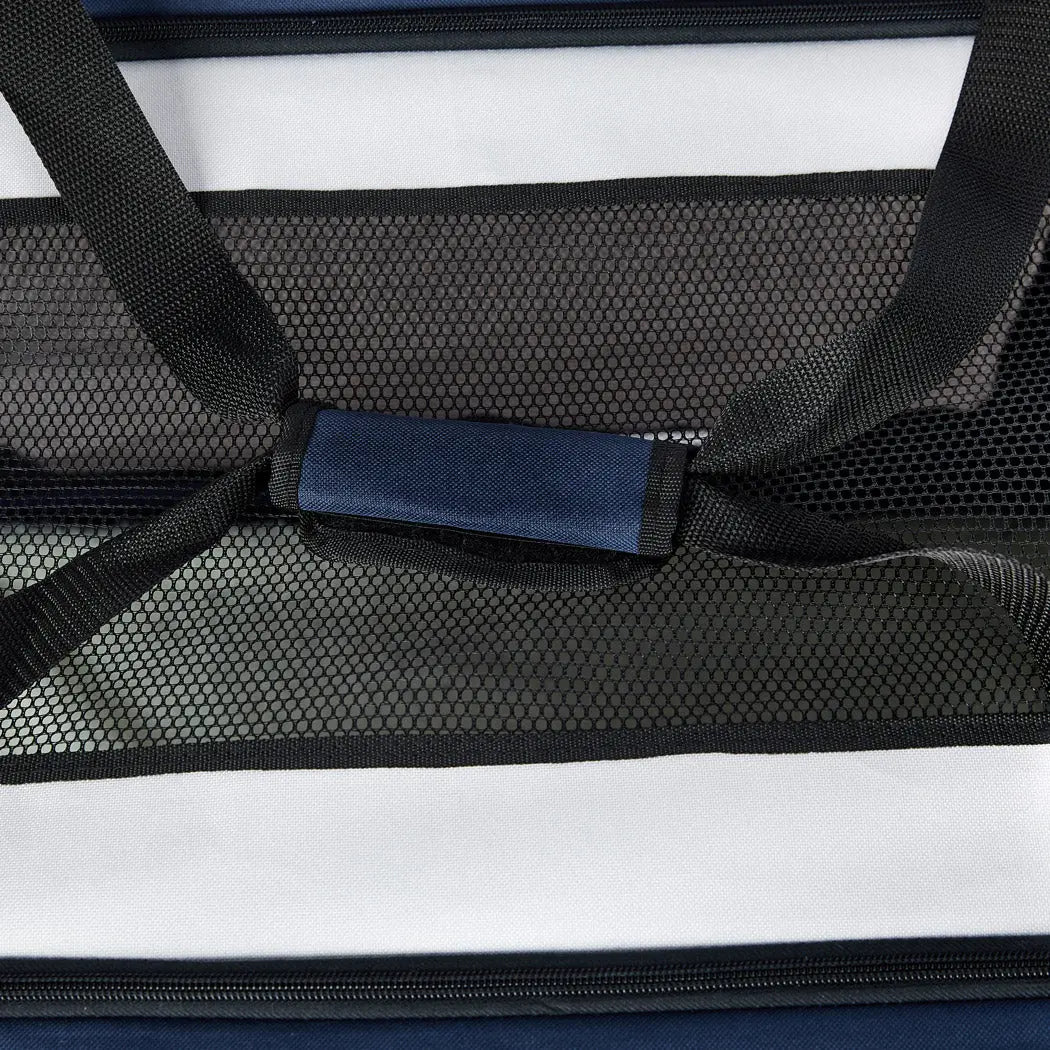 Spacious Pet Carrier Bag for dogs and puppies, featuring a ventilated canopy and durable design, perfect for outdoor travel.