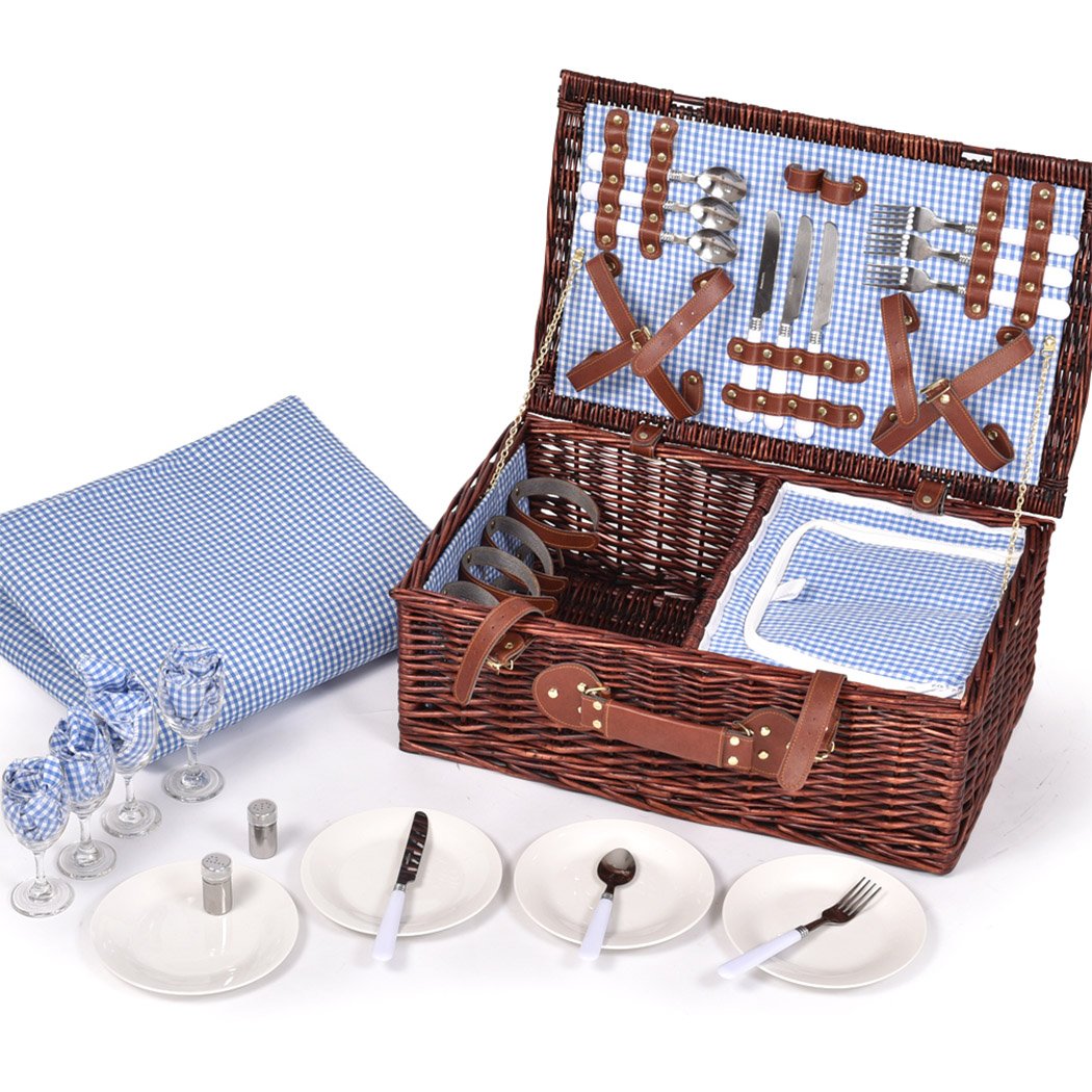 A stylish 4-person picnic basket set made of willow, featuring PU leather straps, an insulated bag, and a matching blanket, perfect for outdoor dining.